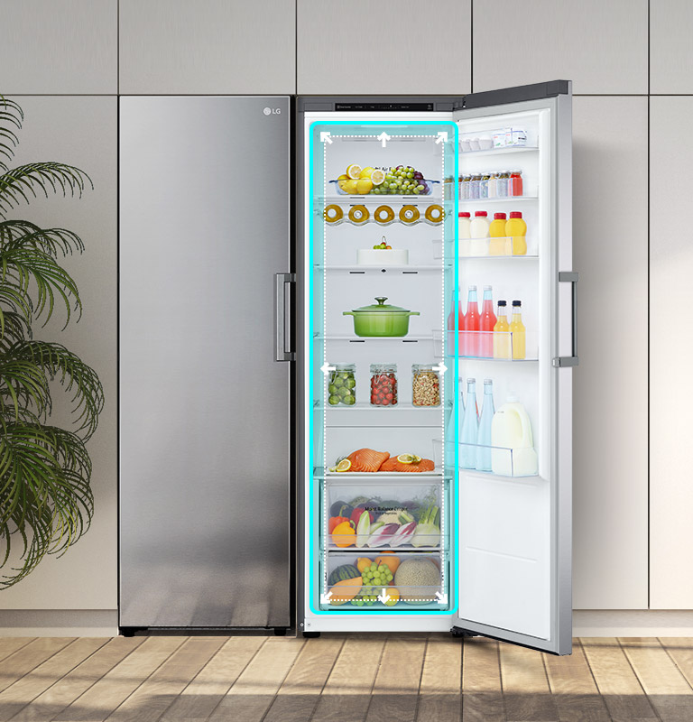 The front view of the fridge is shown in a kitchen with the door open and displaying the produce inside. A blue square highlights the interior with arrows pushing out to indicate there is ample room inside.