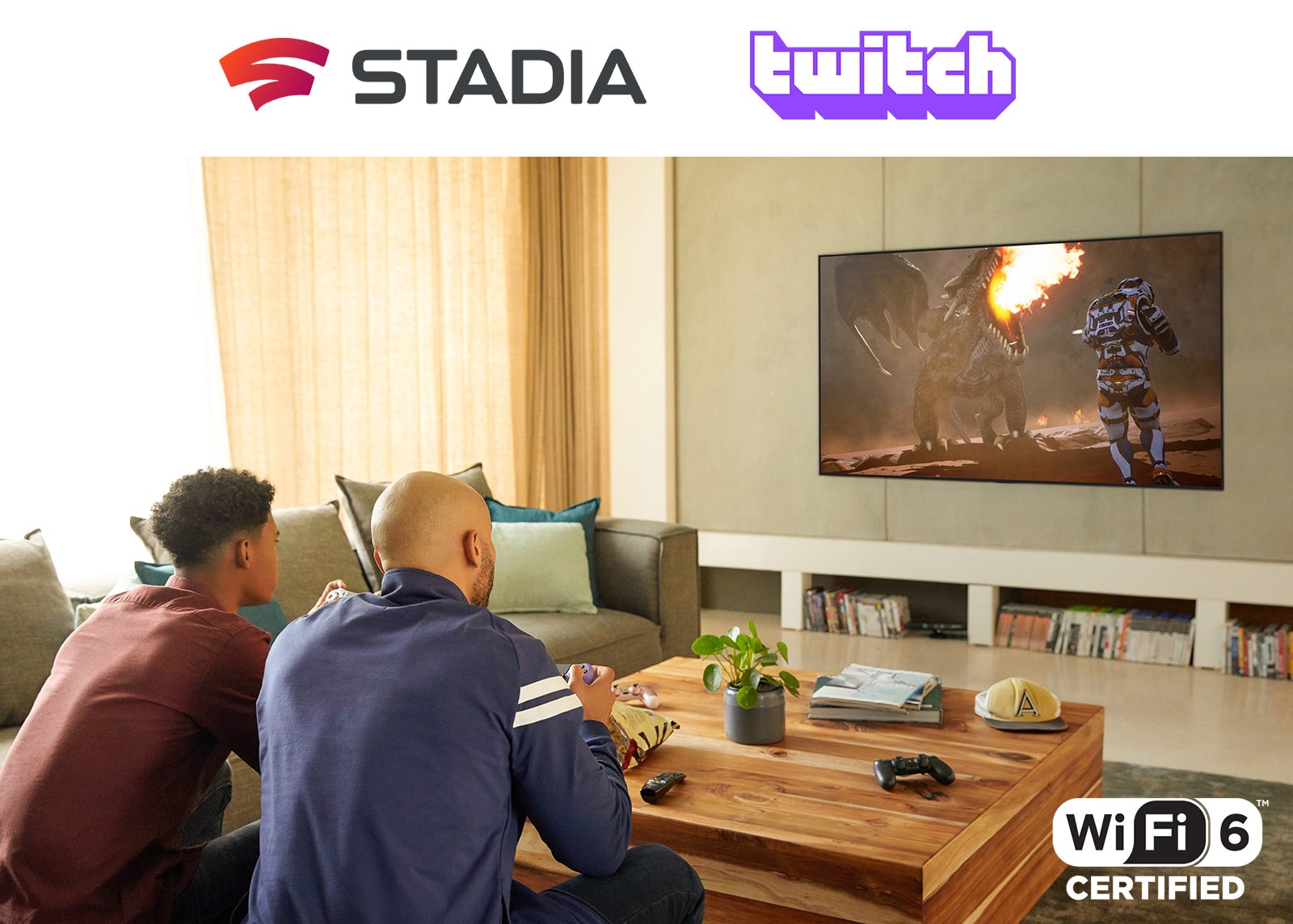 The logo of Google Stadia and Twitch are in a line. Two men sitting on the sofa are playing game with controllers and Wi-Fi 6 certified in a living room.